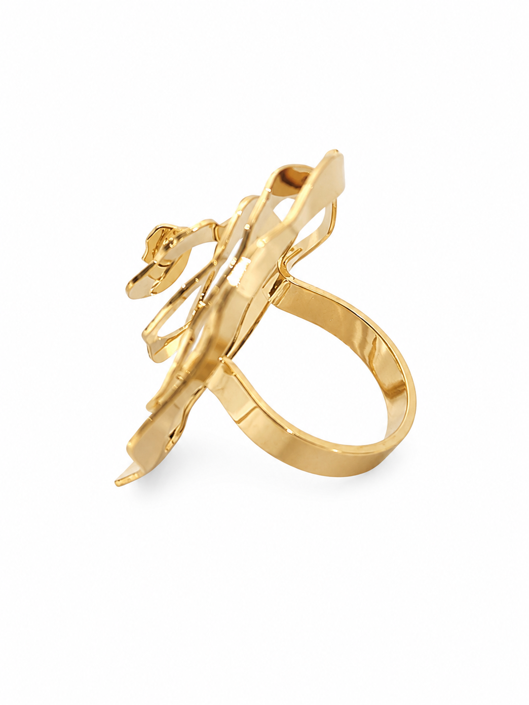 A gold-plated statement ring featuring a sculptural, abstract openwork design with a curved band and a central floral-like element, shown on a plain white background.
