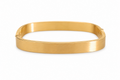 Gold bracelet on a white background