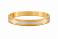 Gold and silver bangle on a white background